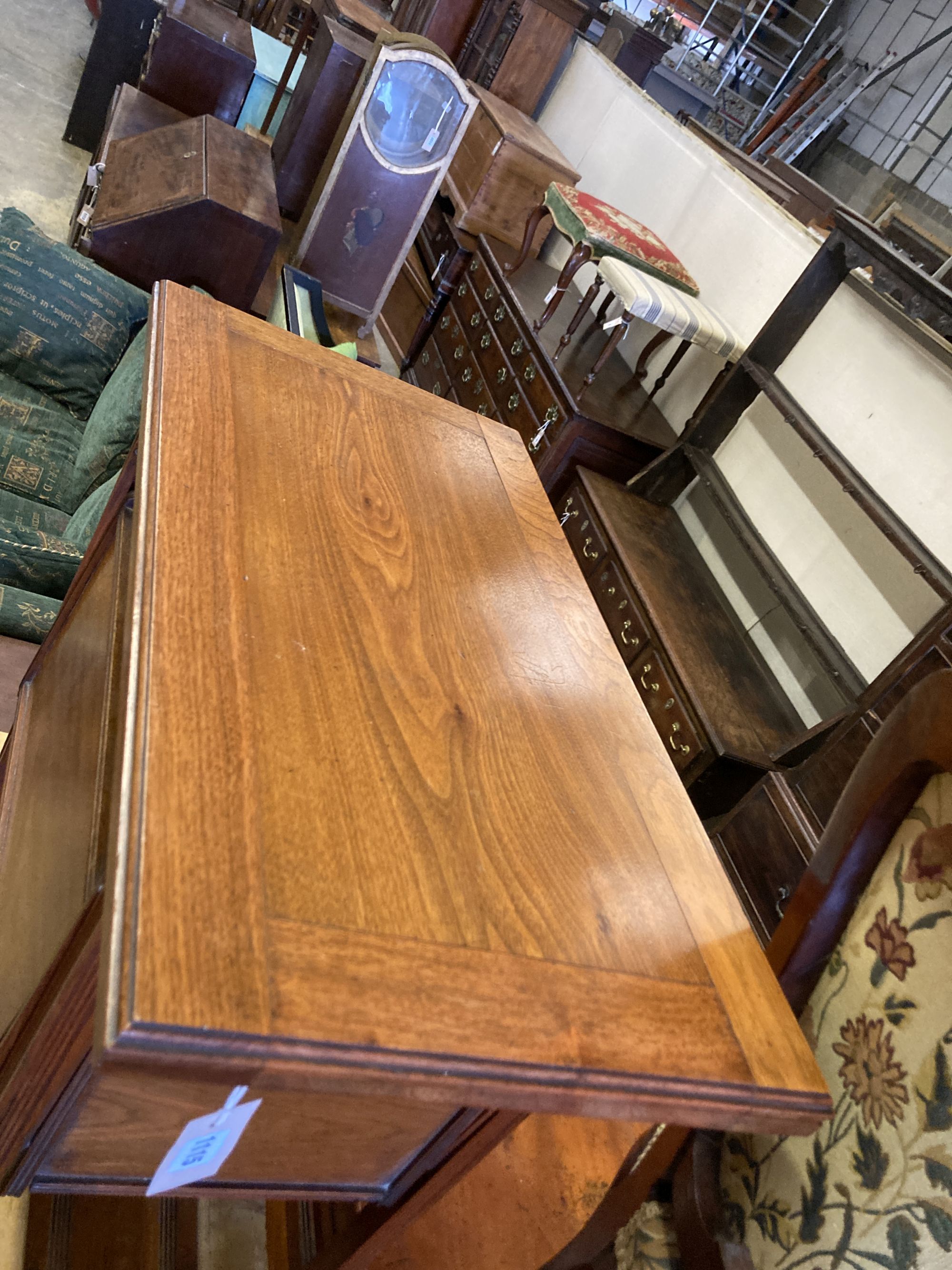 A late Victorian aesthetic movement walnut folding card table, with hinged undertiers, width 71cm, depth 38cm, height 75cm